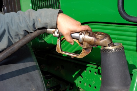 putting fuel into a tractor
